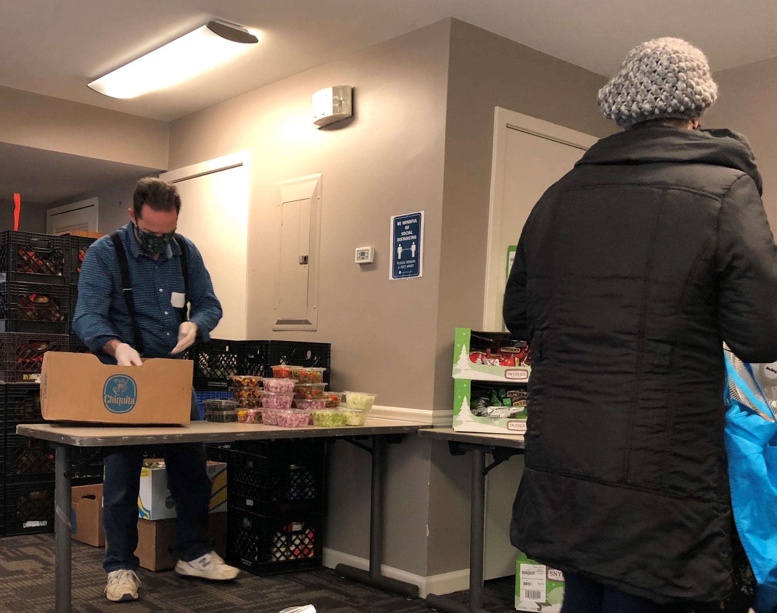 An True Ground resident attends AFAC distribution at Columbia Grove.