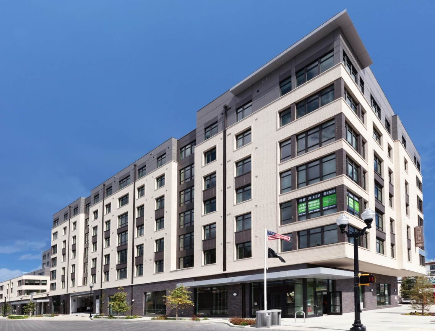 Contemporary apartment building with American flag in front